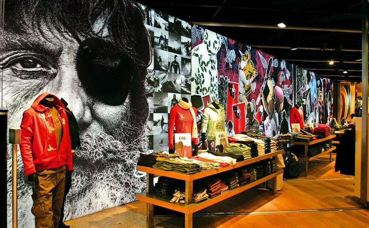 Bright and eye-catching graphics behind clothes displays